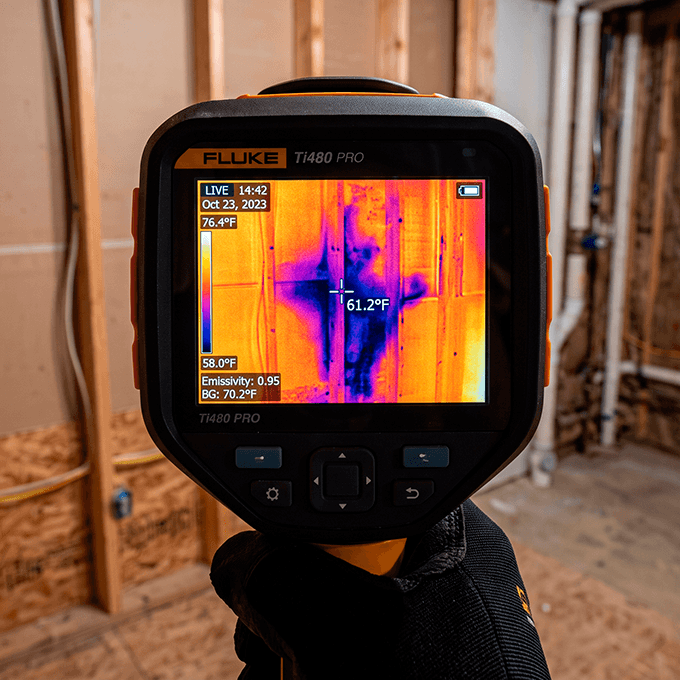 Thermal moisture mapping scanner charting water patterns inside framework